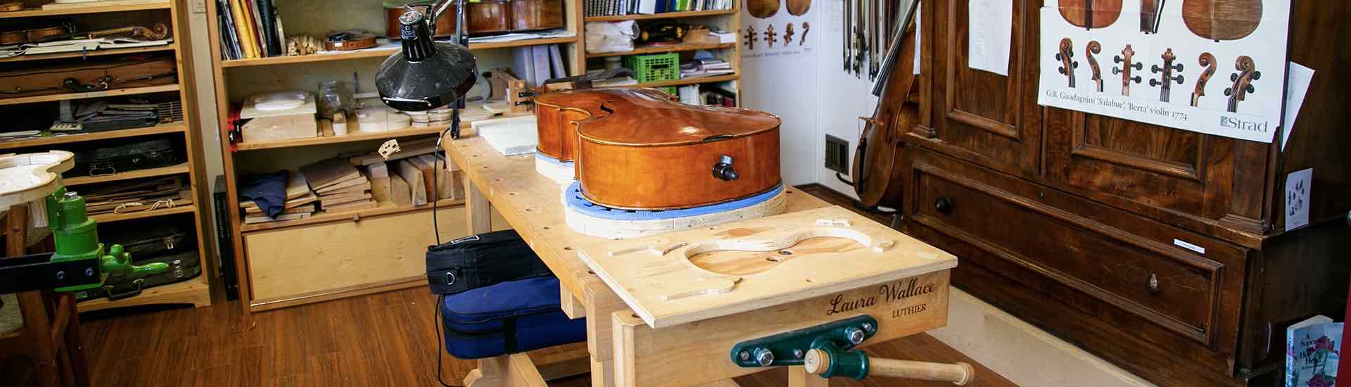 Clement & Wallace custom violin maker's shop with a project on the workbench.