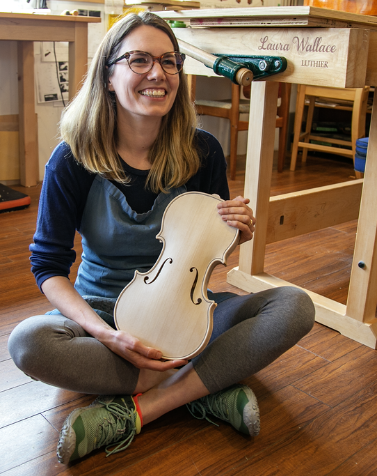 Professional luthier Laura Wallace in her workshop in Powell River, BC, Canada